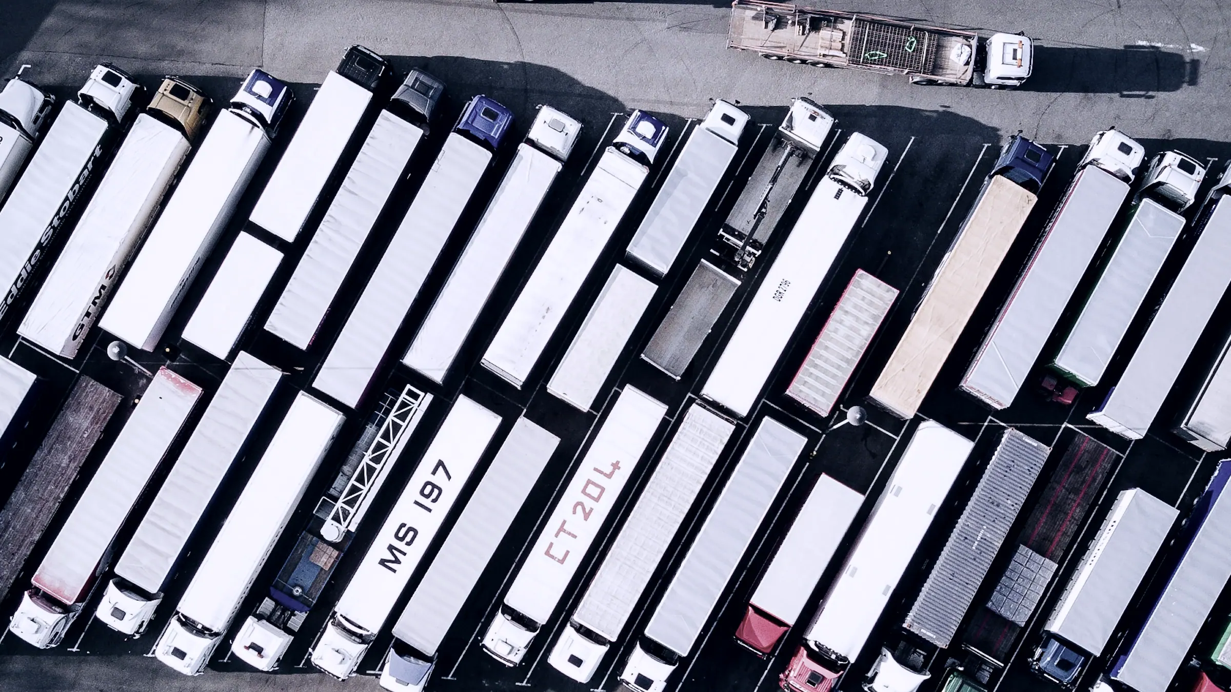 Aerial view of trailers lined up in a freight yard